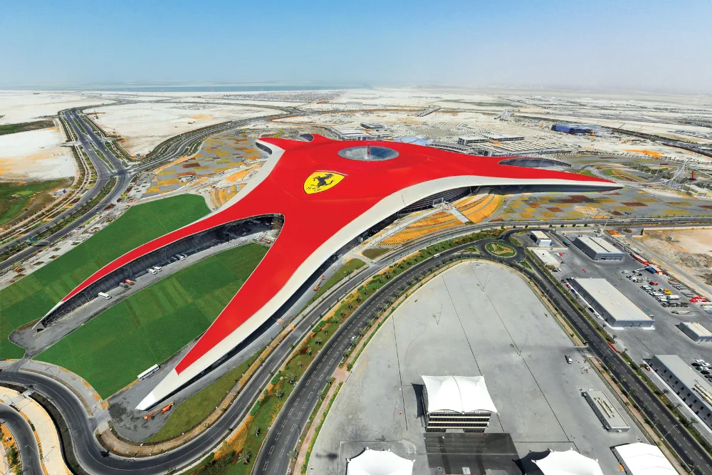 Aerial view of Ferrari World Abu Dhabi's red roof on Yas Island