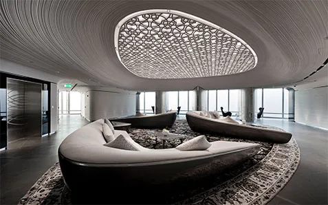 Curved lounge seating area inside Burj Khalifa At The Top
